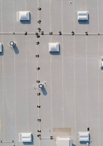 TPO membrane installation on a commercial flat roof in Philadelphia.